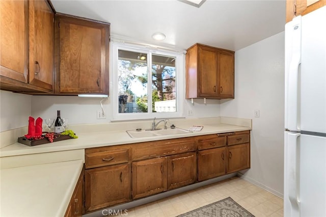 kitchen with white fridge and sink