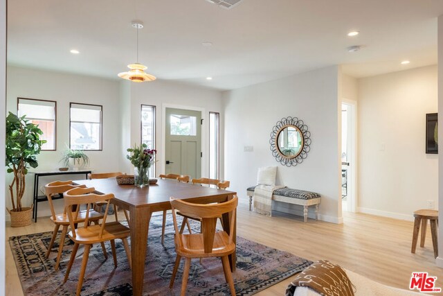 dining area featuring light wood-type flooring