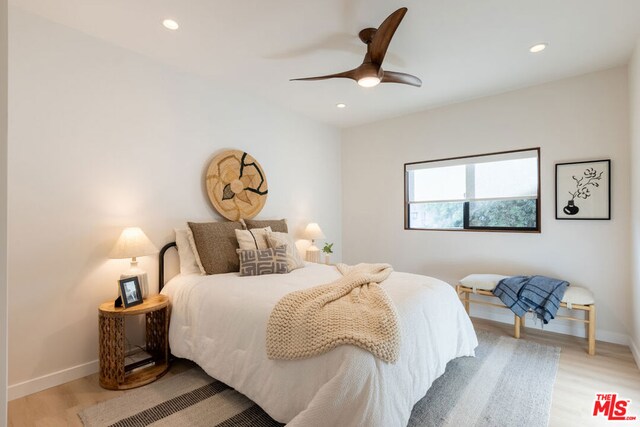 bedroom featuring ceiling fan and light hardwood / wood-style floors