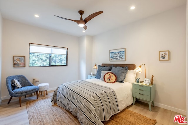 bedroom featuring light hardwood / wood-style floors and ceiling fan