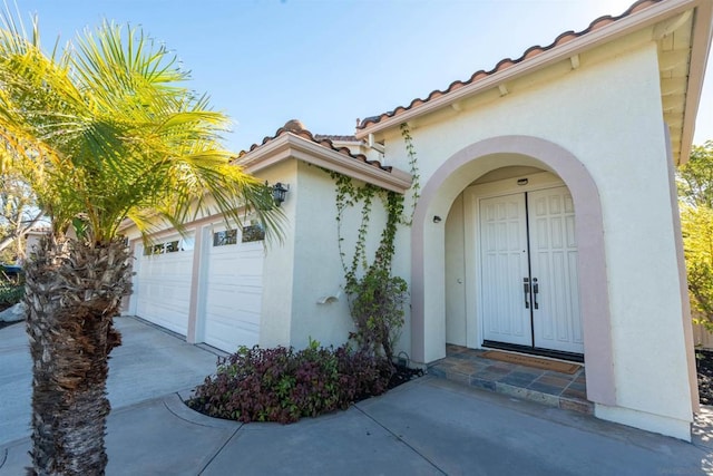 entrance to property featuring a garage