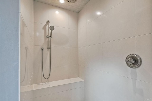 bathroom with tiled shower