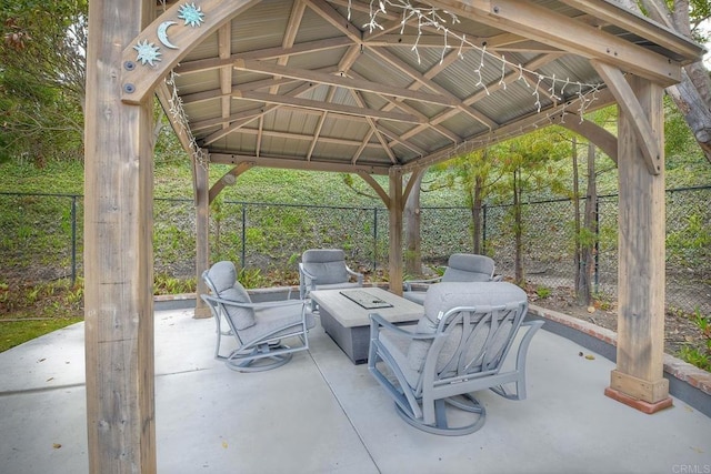 view of patio with a gazebo and a fire pit