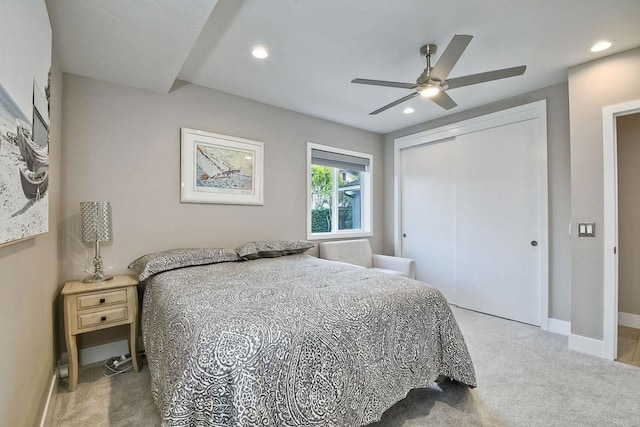 bedroom featuring ceiling fan, a closet, and carpet floors