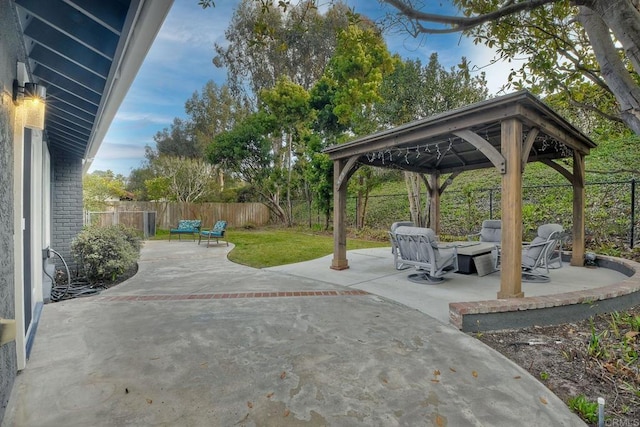 view of patio / terrace featuring an outdoor fire pit and a gazebo