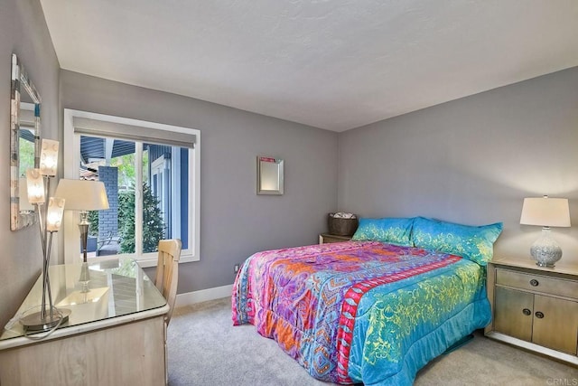 bedroom with light colored carpet