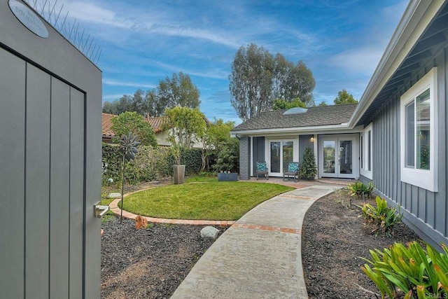 view of yard with french doors