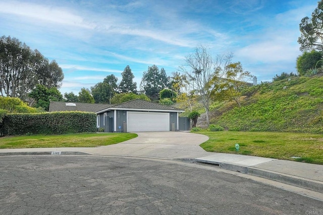 single story home with a front yard and a garage