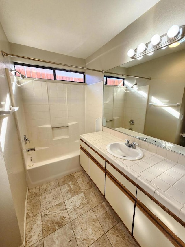 bathroom featuring vanity and shower / washtub combination