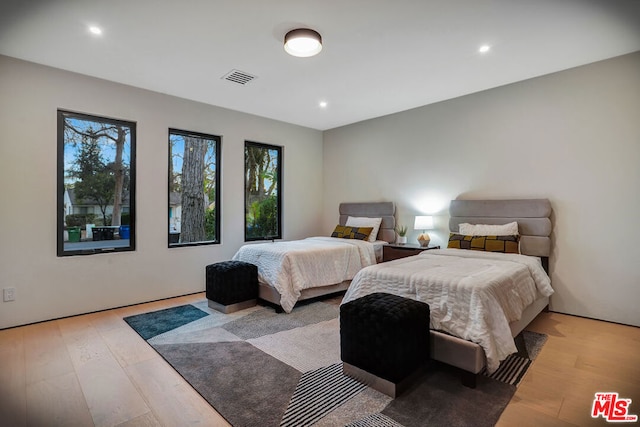 bedroom with light wood-type flooring