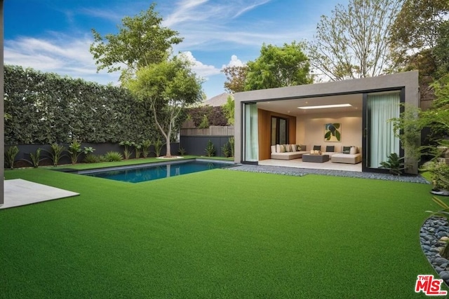 exterior space featuring a fenced in pool, an outdoor hangout area, and a patio