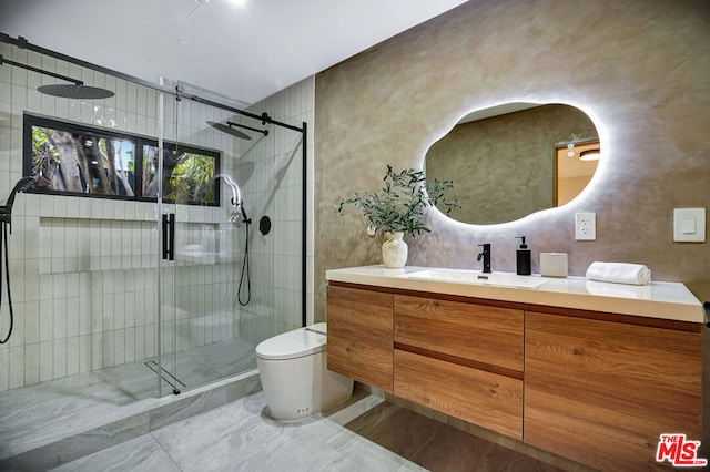 bathroom with toilet, a shower with shower door, and vanity