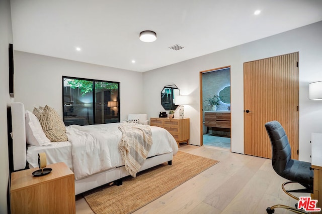 bedroom with light hardwood / wood-style floors