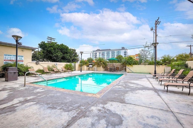 view of pool featuring a patio area