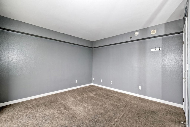 unfurnished room featuring carpet flooring