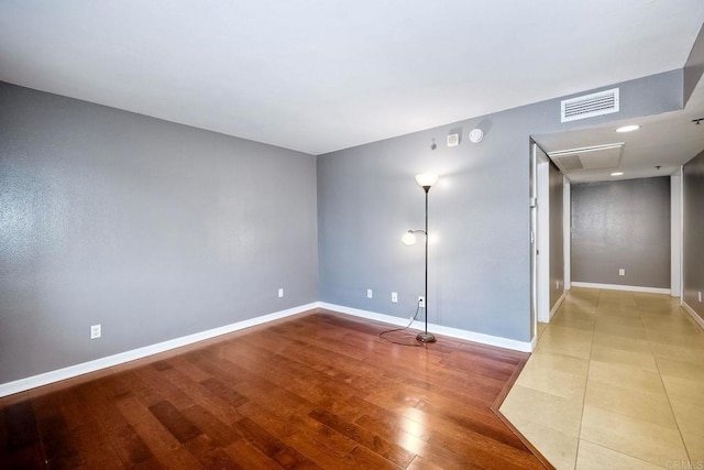 unfurnished room featuring light wood-type flooring