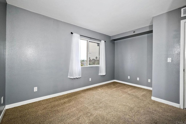 view of carpeted spare room