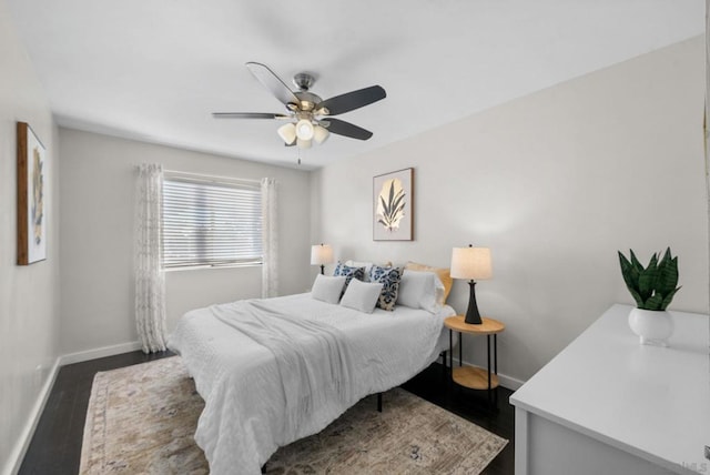 bedroom with dark wood-type flooring and ceiling fan