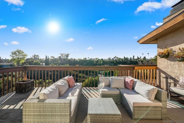 wooden terrace featuring outdoor lounge area