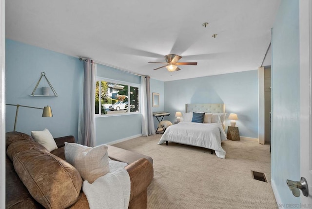 bedroom with light colored carpet and ceiling fan