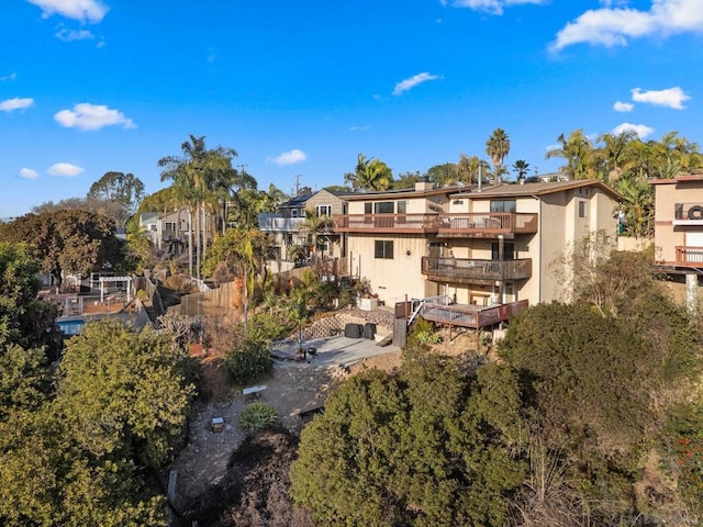 back of property featuring a balcony