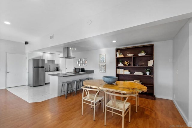 dining room with light wood-type flooring