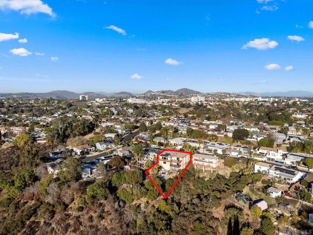 birds eye view of property with a mountain view