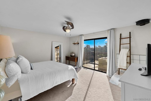 bedroom featuring ceiling fan, access to exterior, and light colored carpet