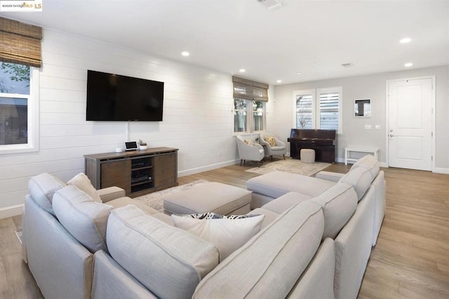 living room with light hardwood / wood-style floors