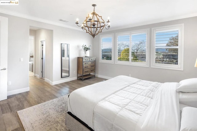 bedroom featuring dark hardwood / wood-style flooring, crown molding, a chandelier, and multiple windows