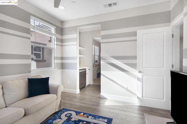 sitting room with hardwood / wood-style flooring