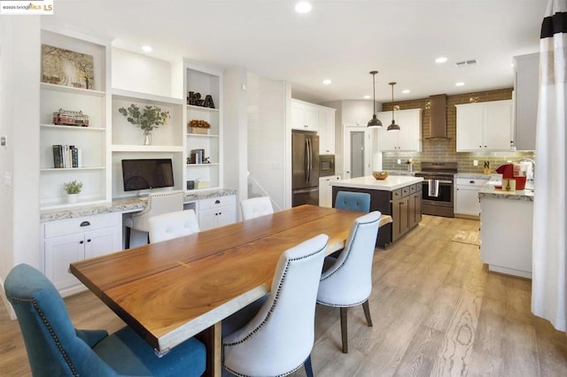 dining room featuring light hardwood / wood-style flooring