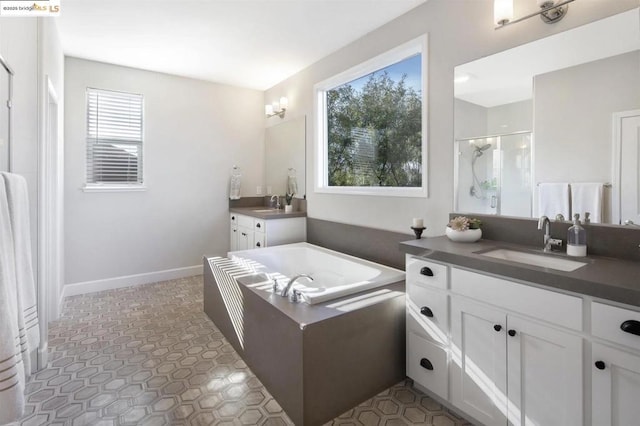 bathroom with vanity and plus walk in shower