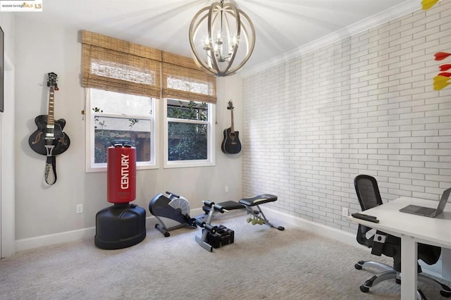 exercise room featuring carpet floors, brick wall, crown molding, and a chandelier