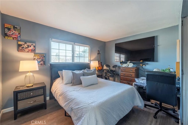 bedroom featuring dark hardwood / wood-style flooring