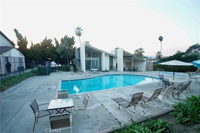 view of swimming pool with a patio area