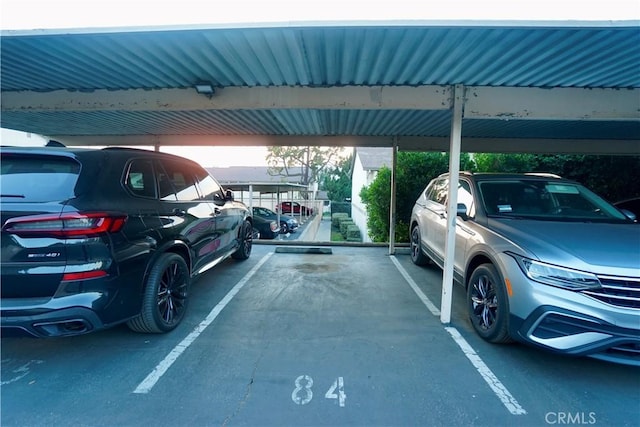 view of parking / parking lot with a carport