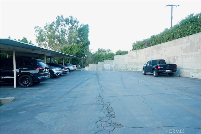 view of parking / parking lot with a carport