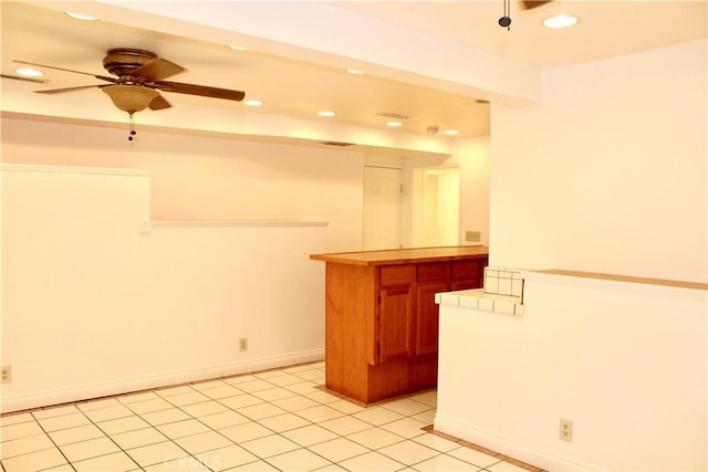 kitchen featuring ceiling fan and light tile patterned flooring