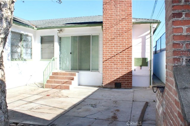 doorway to property featuring a patio