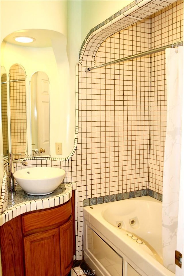 bathroom featuring a tub and vanity