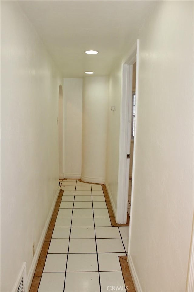 hallway with light tile patterned floors