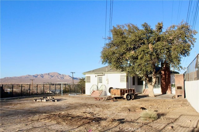 rear view of house with a mountain view