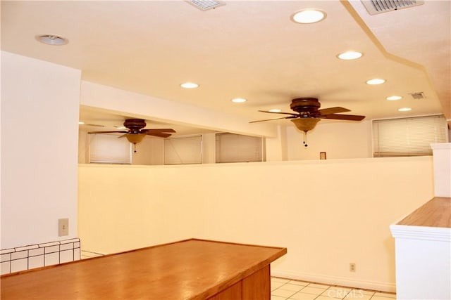 kitchen featuring ceiling fan and light tile patterned flooring