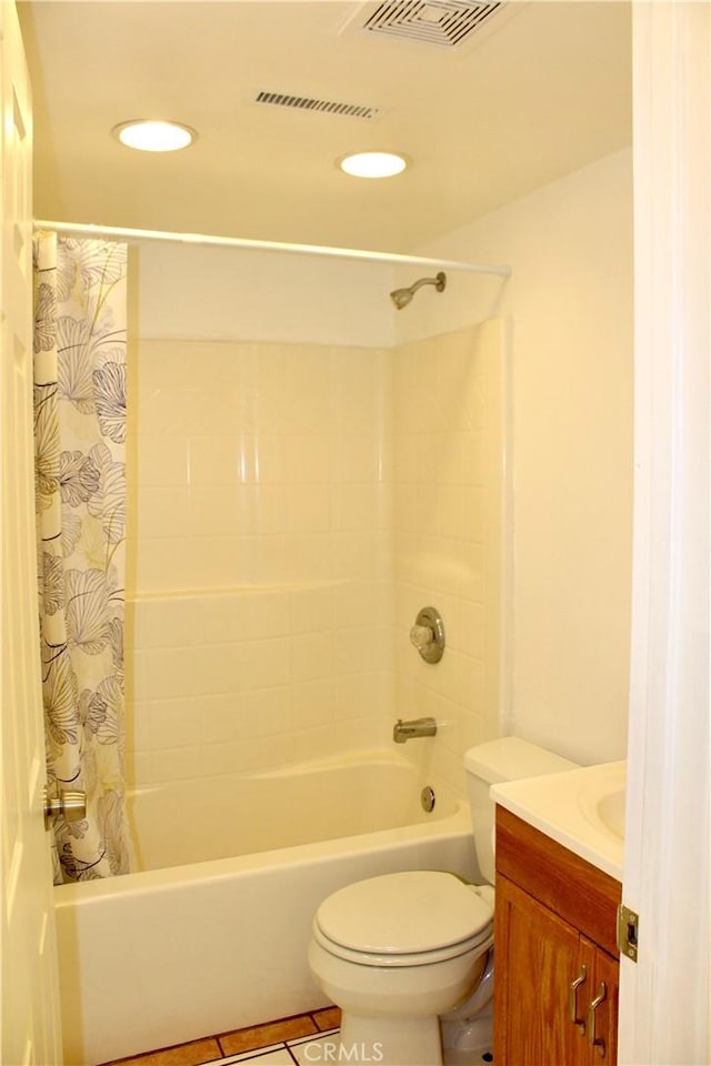 full bathroom with toilet, tile patterned flooring, shower / bath combo, and vanity