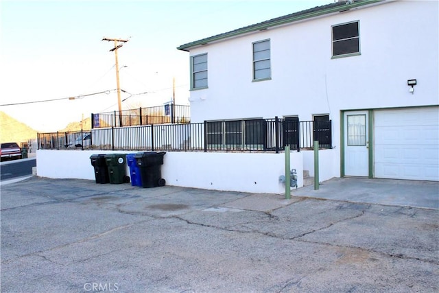 view of property exterior with a garage