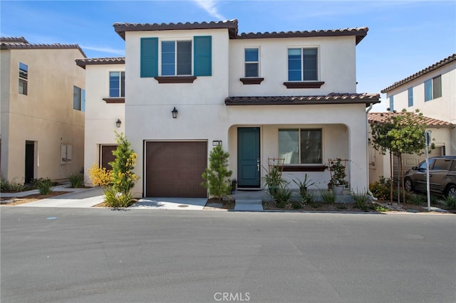 mediterranean / spanish-style house featuring a garage