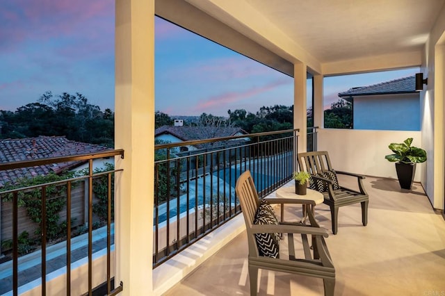 view of balcony at dusk