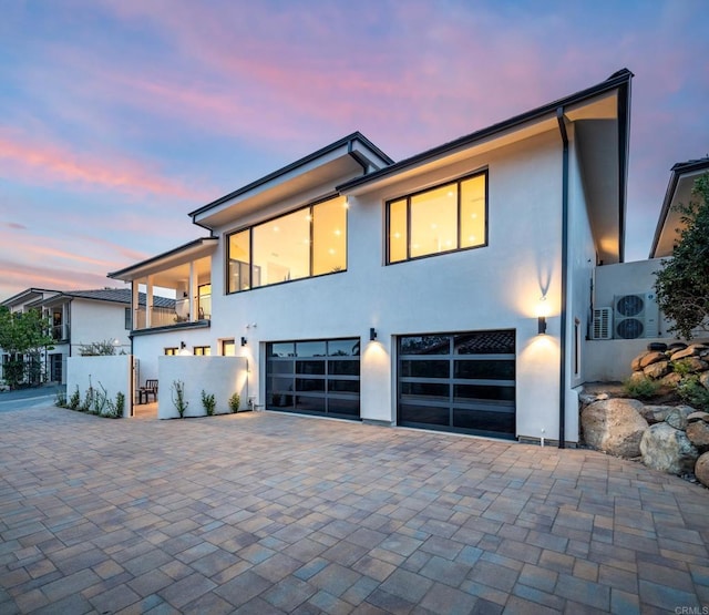 contemporary house featuring a balcony and a garage