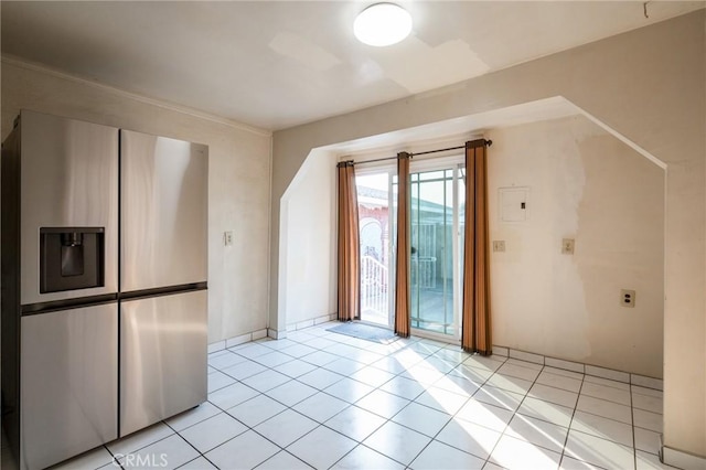 additional living space with light tile patterned floors